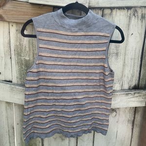 Gray sleeveless turtleneck